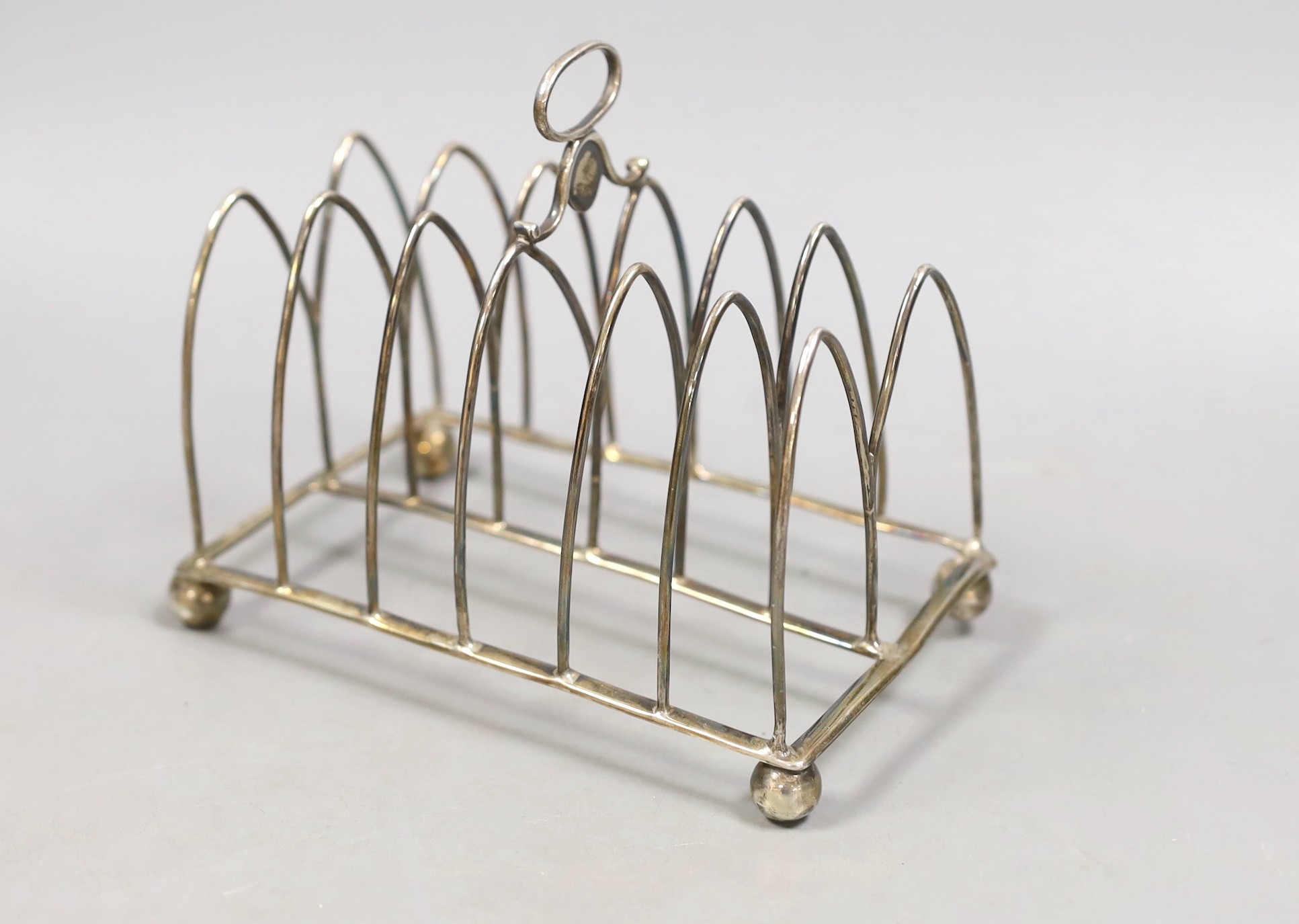 A George III silver seven bar toastrack, Soloman Hougham, London, 1805. length 15cm, 180 grams, (a.f.).